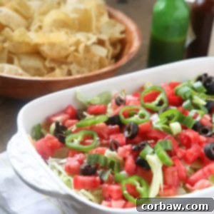 layered taco dip, a vibrant and delicious appetizer perfect for any occasion.