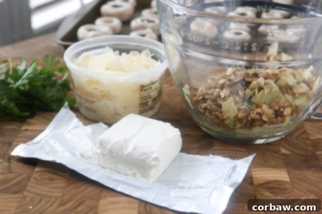 These Artichoke Stuffed Mushrooms have a creamy, cheesy filling and are easy to make - perfect for entertaining! #ad #UndeniablyDairy 