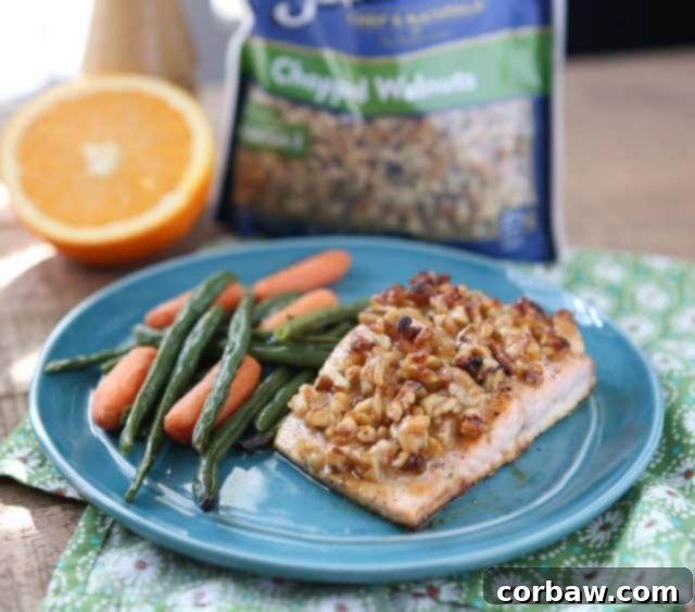 Flaky Orange Walnut Crusted Salmon fillet with a vibrant, golden-brown crust, ready to be served for a healthy dinner.