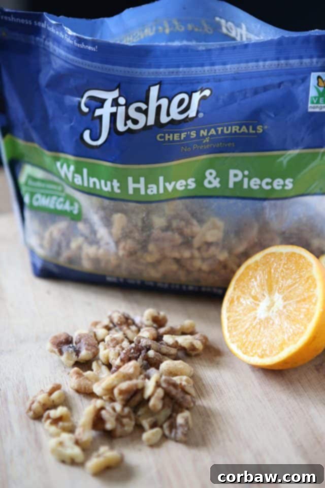 Close-up of baked Orange Walnut Crusted Salmon, showing the crispy topping and perfectly cooked fish, ready to flake.