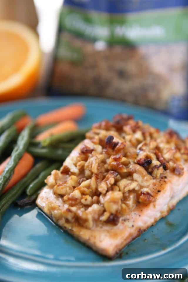 Arrangement of fresh ingredients for Orange Walnut Crusted Salmon, including walnuts, oranges, honey, and olive oil.