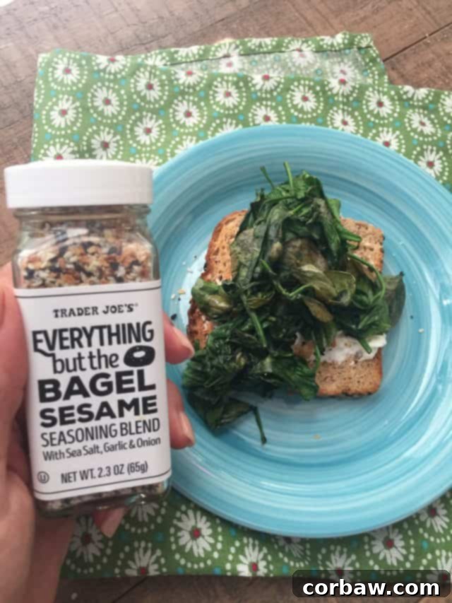 A close-up of the delicious Spinach and Egg Breakfast Toast, showing the perfectly cooked egg and vibrant spinach. This Spinach and Egg Breakfast Toast is packed with protein and good carbs, ensuring you stay full and satisfied all morning long.