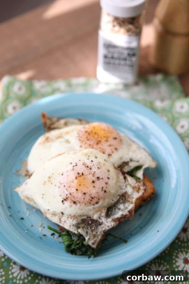 Enjoy perfectly cooked eggs with firm whites and a runny yolk, ready to be placed on your nutritious spinach and cream cheese toast. Achieve perfection with your eggs: crispy on the bottom, cooked on top, and a soft, runny yolk in the middle. The ideal complement to your spinach toast.