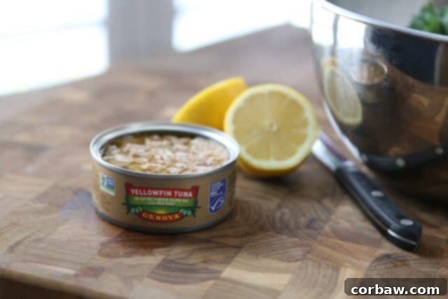 Close-up of a delicious Lemony Tuna and White Bean Kale Salad, highlighting the fresh ingredients and rich Genova tuna. #tuna #kale #salad #avocado #quicklunch