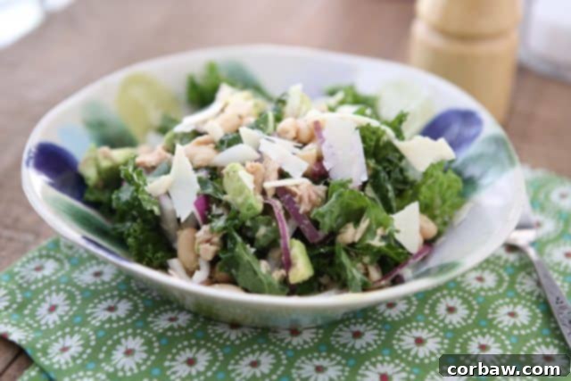 A spread of fresh ingredients for the Lemony Tuna and White Bean Kale Salad, including Genova tuna, kale, white beans, and avocado. #tuna #kale #salad #avocado #ingredients