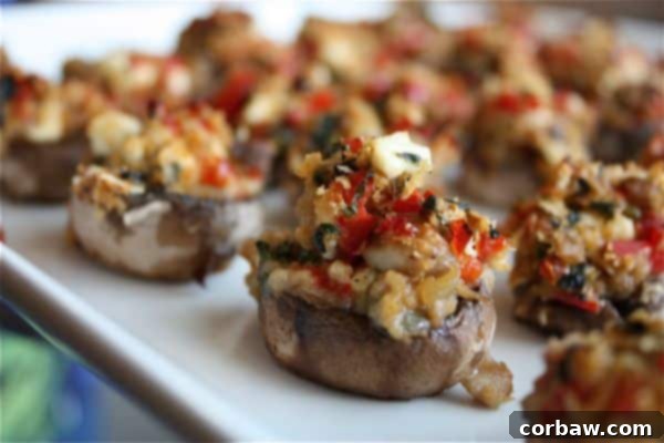 Beautifully arranged Mediterranean Stuffed Mushrooms on a serving platter