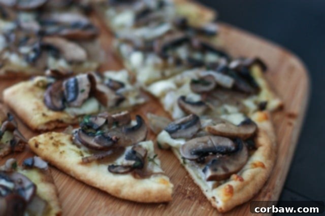 Grilled Baby Portabella Mushroom Pesto Flatbreads with cherry tomatoes and basil