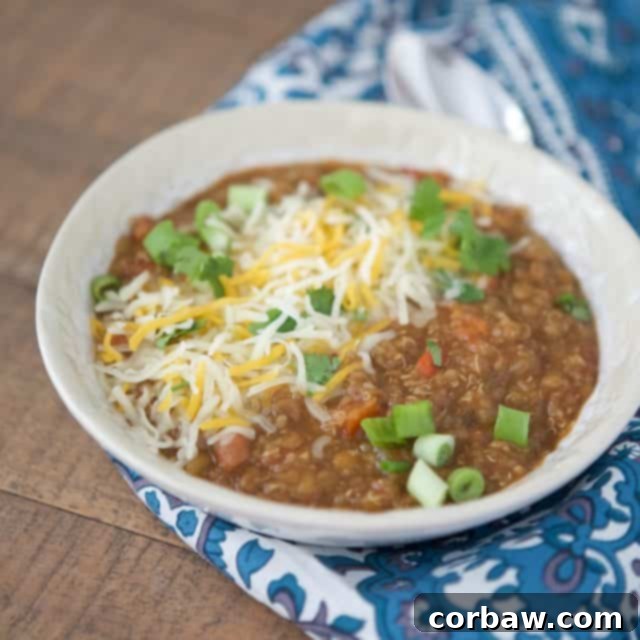 Hearty Instant Pot Vegetarian Chili 3 Close-up of a bowl of Instant Pot Vegetarian Chili with vibrant green toppings, perfect for a healthy and satisfying meal.