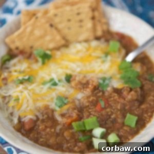 A bowl of Instant Pot Vegetarian Chili, garnished and ready to eat.