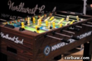 Ninkasi Brewing Company booth with foosball table and beer samples