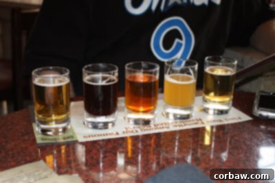 A beer flight featuring a variety of craft beers in small glasses at Gordon Biersch