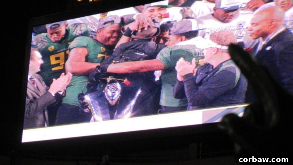 Oregon Ducks players showing appreciation to university president Lariviere