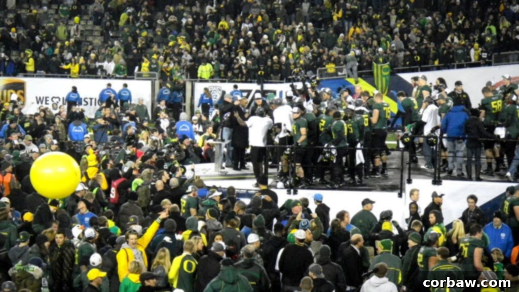 Fans and the Oregon Ducks team celebrating the historic victory together