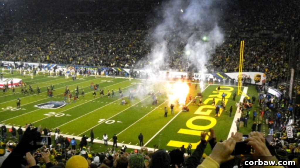 Oregon Ducks players making their dramatic entrance through fire and fireworks
