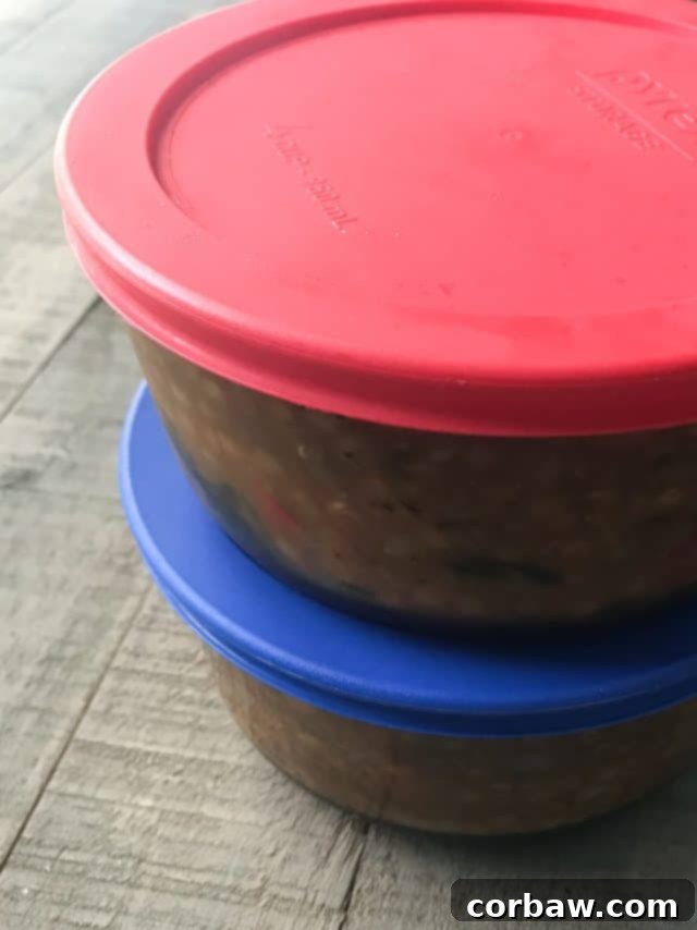 Hearty Italian Tomato Lentil Spinach Soup 5 Glass Pyrex containers filled with leftover Italian lentil soup, ready for freezing