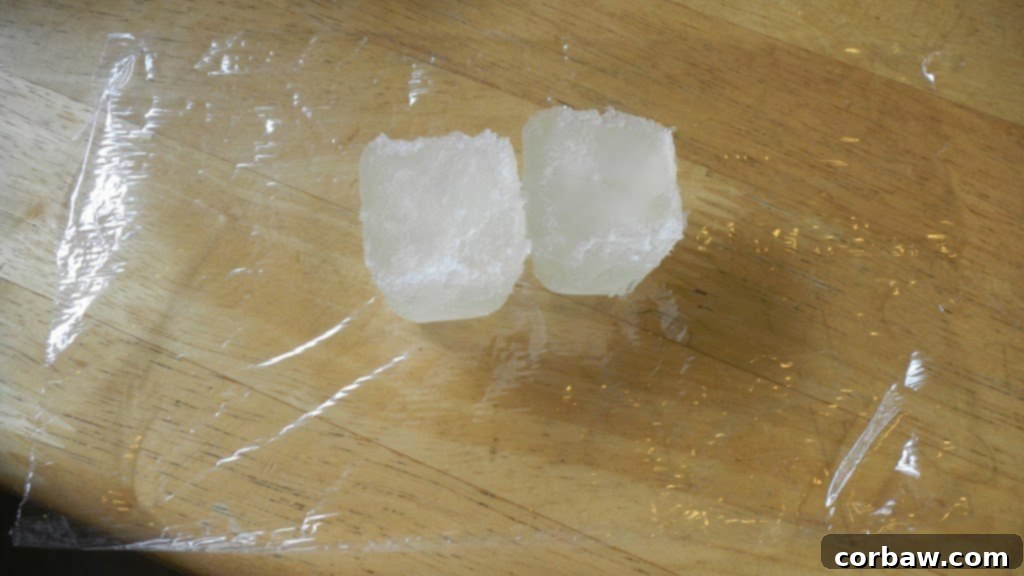 Individually wrapped frozen wine cubes in plastic wrap