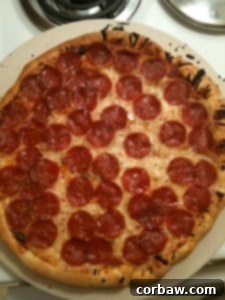 Freshly baked pizza with a perfect crust on a pizza stone