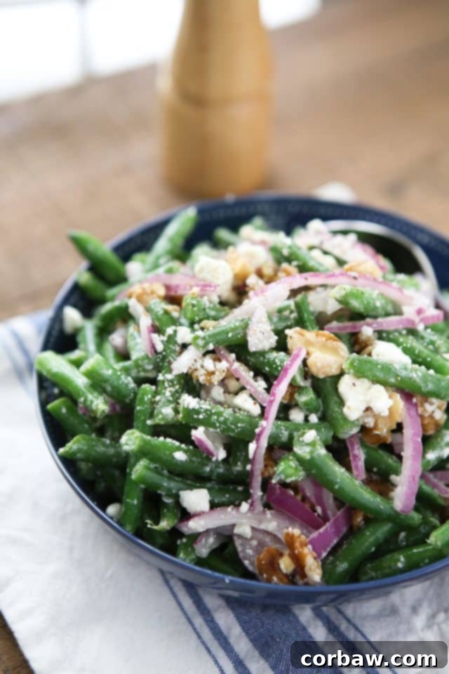 Finished Green Bean Salad with Feta, ready to serve Beautifully arranged Green Bean Salad with Feta and fresh parsley garnish