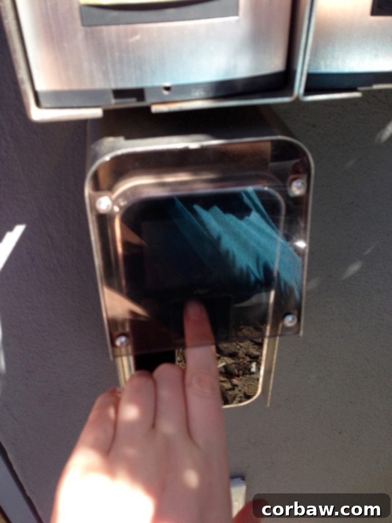 A fingerprint scanner used for entry into the building, demonstrating advanced security measures.