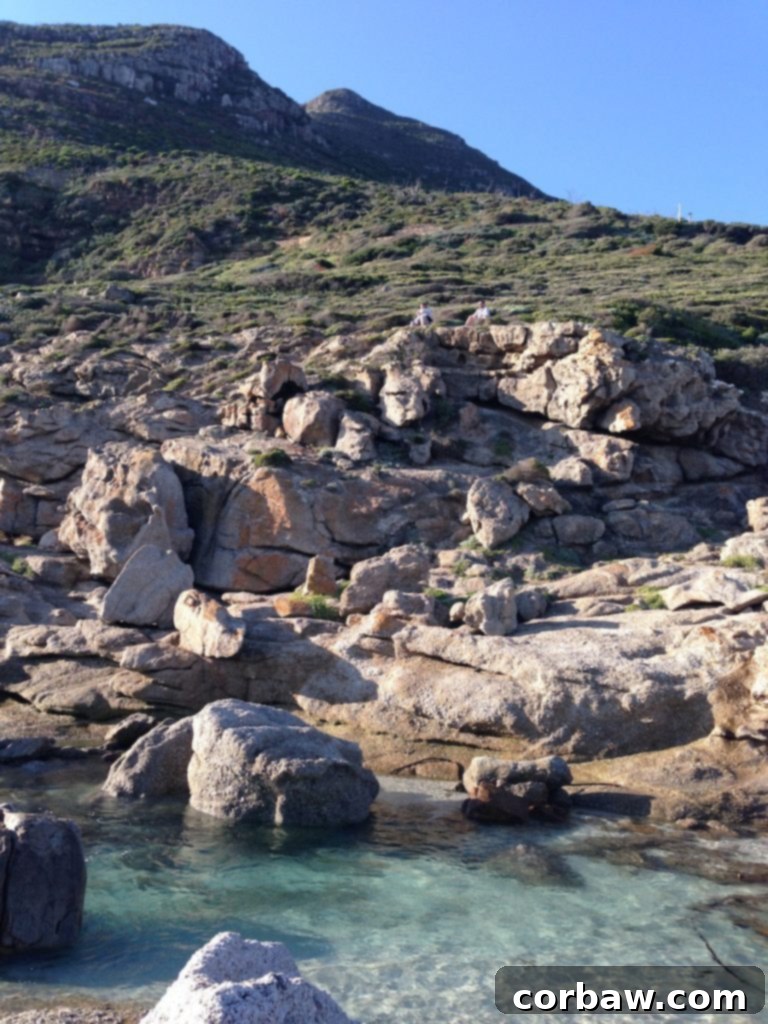 Fiancé and friend enjoying rock climbing at Noordhoek Beach