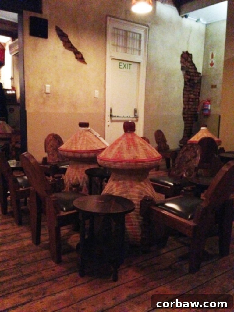 Interior view of Addis in Cape restaurant, showing low seating and traditional decor.