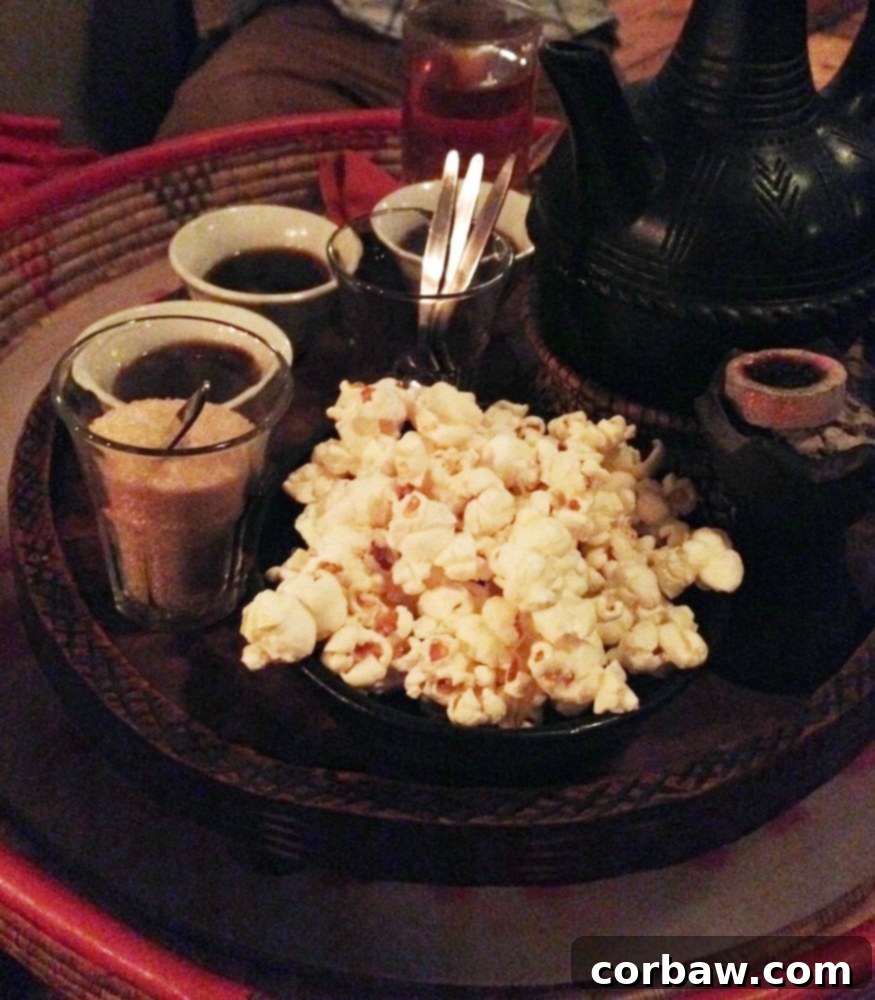 Ethiopian coffee and popcorn served after the meal, a traditional pairing.