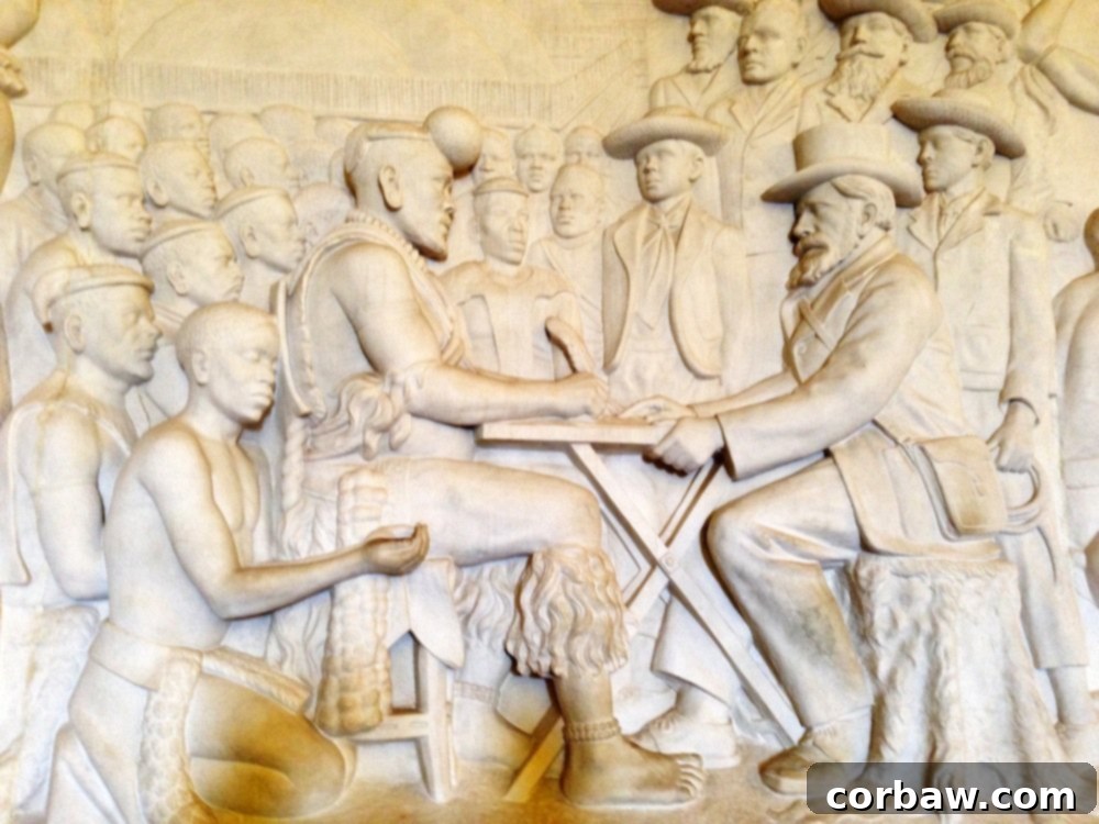 Close-up of the Voortrekker Monument frieze, highlighting figures and details.