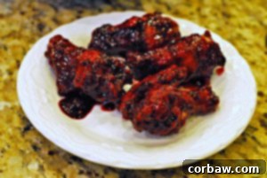 Blackberry chipotle hot wings on a platter.