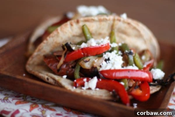 Grilled Chicken Sausage and Peppers Pita recipe 3 Freshly sliced chicken sausage and colorful bell peppers ready for grilling