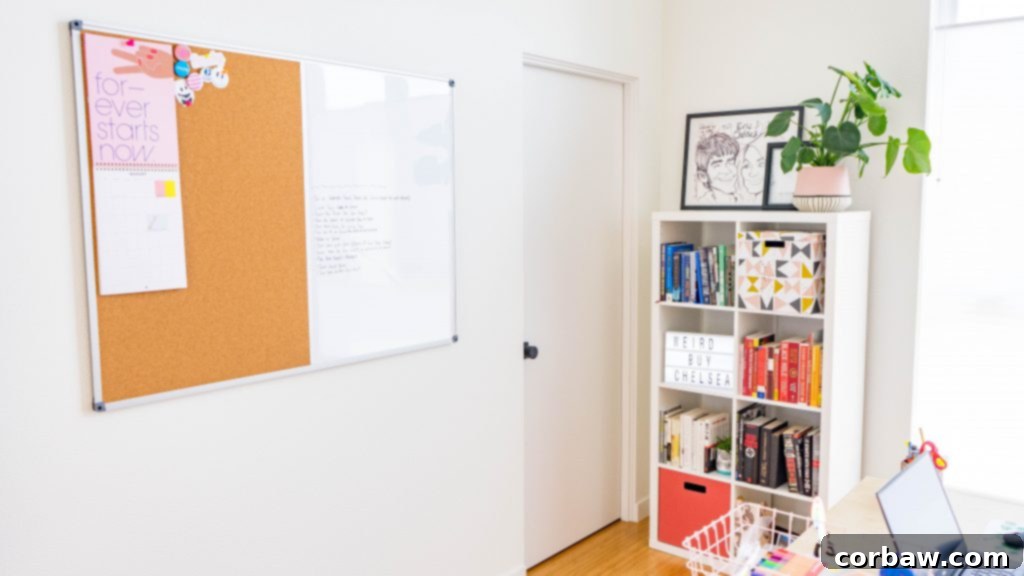 The home office featuring a large plant and various office supplies.