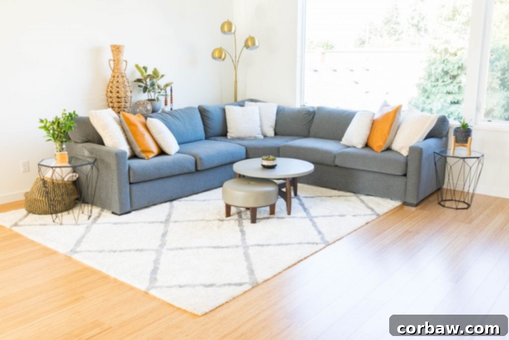 A wider view of the living room showcasing the comfortable seating area and decor.