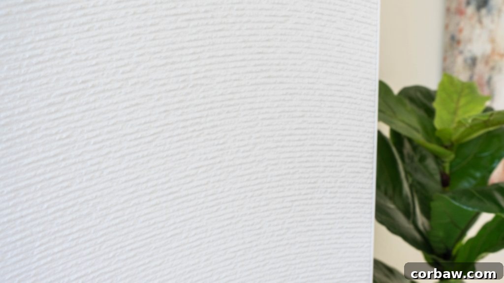 Close-up of a fireplace showing textured white tile.