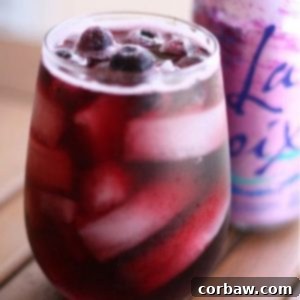 Red Wine Berry Spritzer with fresh fruit garnish