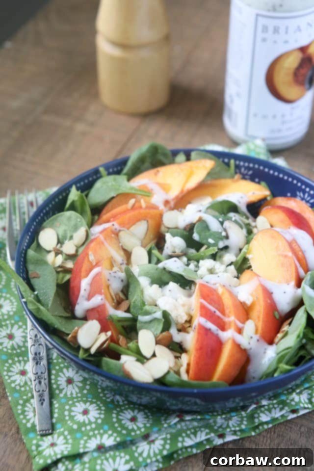 Summer Spinach Salad with Peaches, Gorgonzola and Almonds Fresh Spinach Salad with Sliced Peaches, Crumbled Gorgonzola, and Toasted Almonds