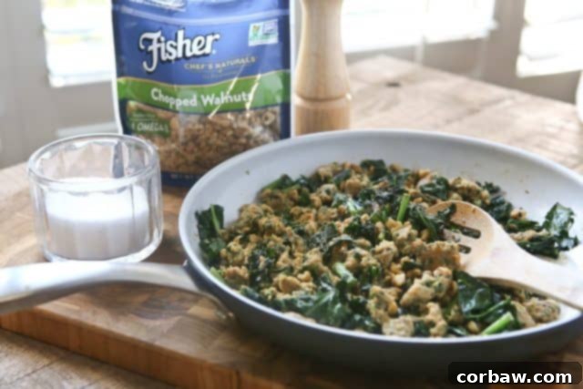 Stuffed Acorn Squash: Perfect for Entertaining and Meal Prep This Stuffed Acorn Squash is filled with hearty ingredients like sausage, kale & walnuts. Makes a wonderful dish for entertaining or even healthy meal prep! #ad #ThinkFisher @FisherNutsBrand