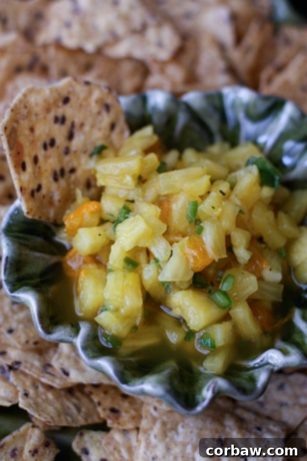 The BEST Pineapple Salsa, bursting with fresh flavors. Sweet and juicy pineapple, zesty lime, spicy jalapeños, and fragrant cilantro create a perfect balance. Ideal with tortilla chips or as a topping for grilled chicken and fish.