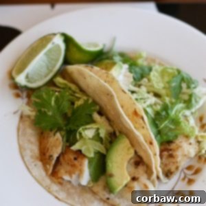 Grilled Fish Tacos with fresh toppings and lime