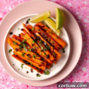 Mastering Steak Sides: 20+ Perfect Pairings and Pitfalls 20 Sous vide carrots on a plate with fresh jalapeños, cilantro, and limes on a pink surface.