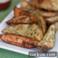 Golden brown roasted dill potato wedges with fresh dill garnish.