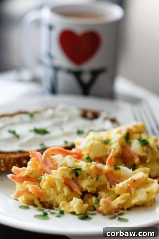 Deluxe Salmon Scramble 4 Beautifully plated Smoked Salmon Scrambled Eggs, garnished with chives and served with crispy toast.