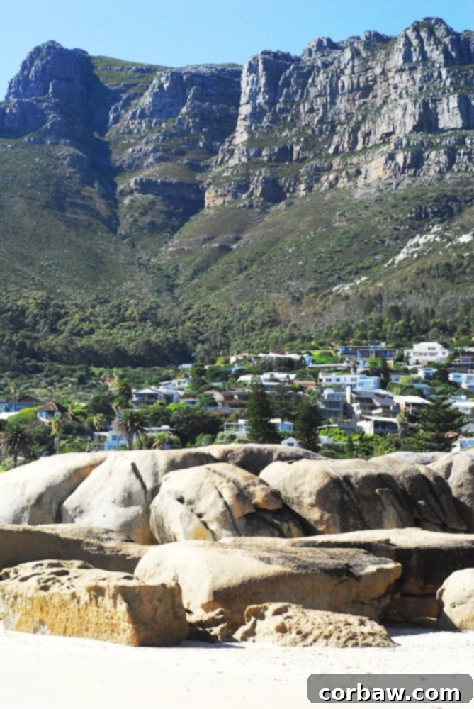 A stunning view of the rugged coastal landscape behind the beach.
