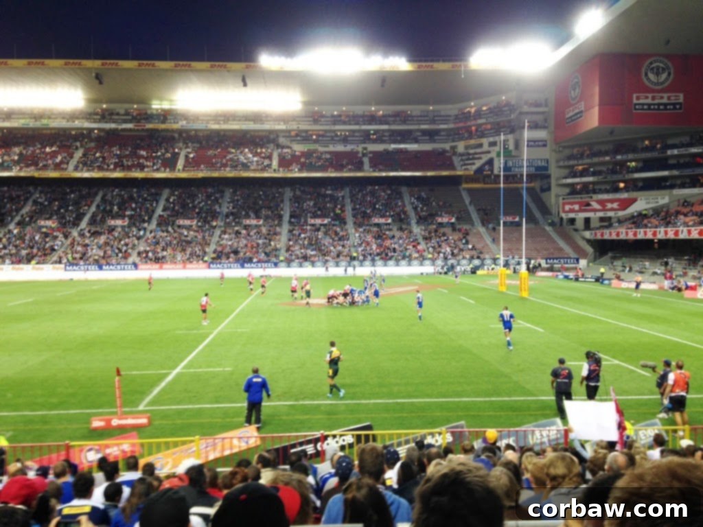 SA Sunday Rugby Showdown 3 Exterior view of the rugby stadium, bustling with fans.