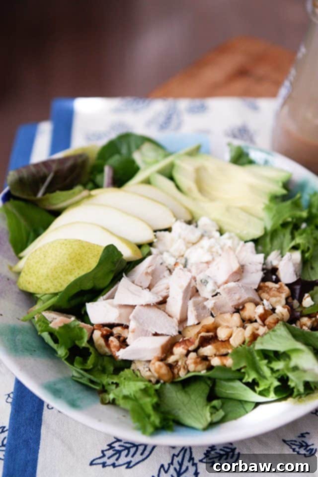 Avocado, Pear, and Chicken Salad 4 close up of salad with chopped rotisserie chicken, walnuts and sliced pears and avocado