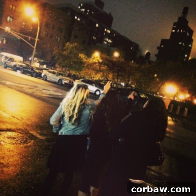 Hailing a cab in New York City at night, a quintessential city experience