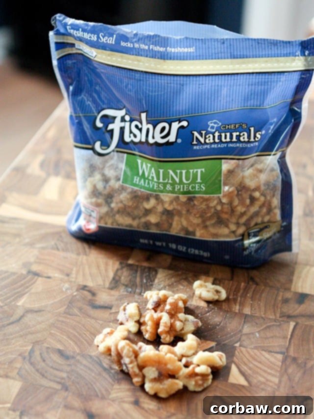 A vibrant bowl of Apple, Celery, and Walnut Salad, garnished with fresh herbs and a drizzle of Honey Dijon Vinaigrette.