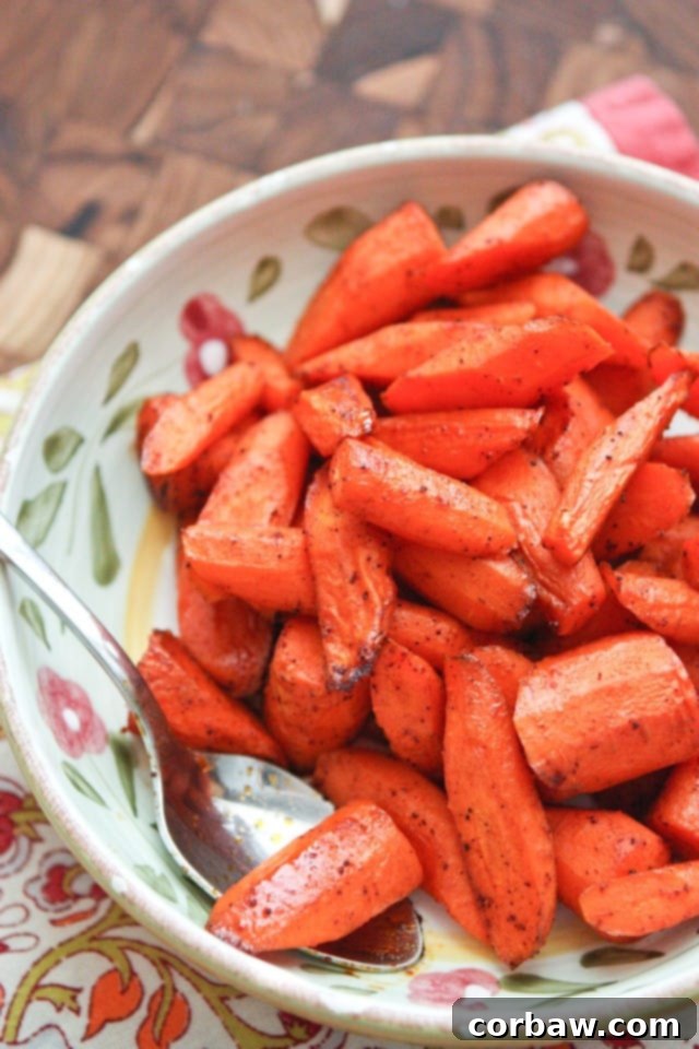 Fiery Maple Roasted Carrots 2 Delicious Chili Maple Roasted Carrots on a serving plate, a perfect healthy and easy side dish for family dinners.