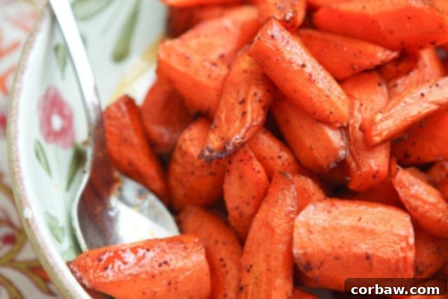 Fiery Maple Roasted Carrots 4 A bowl of freshly roasted Chili Maple Carrots, ready to be served as a healthy and flavorful side dish.