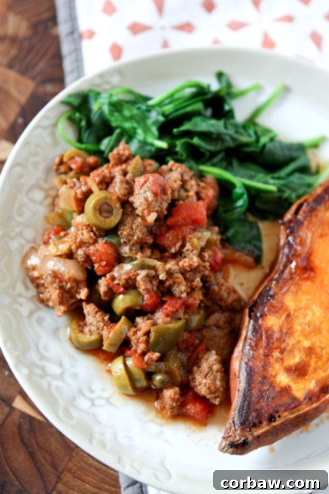 A close-up of Slow Cooker Picadillo in a bowl, ready to serve