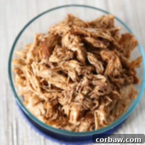 Make a weekly batch of this Slow Cooker Shredded Barbecue Chicken recipe - so many ways to use it in meals!