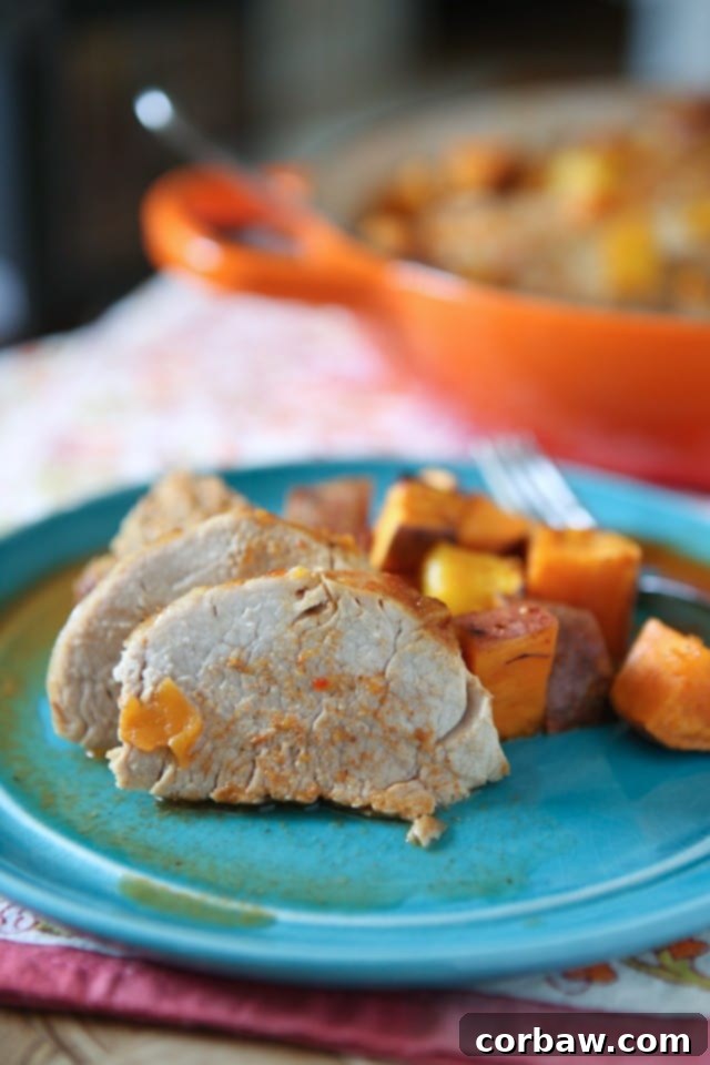 Plated Maple Mustard Roasted Pork Tenderloin with Sweet Potatoes and Mango ready to serve.